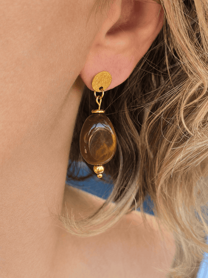 Bijou femme coloré en acier inoxydable doré avec perles ovales brillantes.