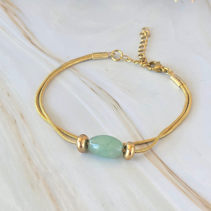 Bracelet AURA en acier inoxydable doré avec perle en aventurine
