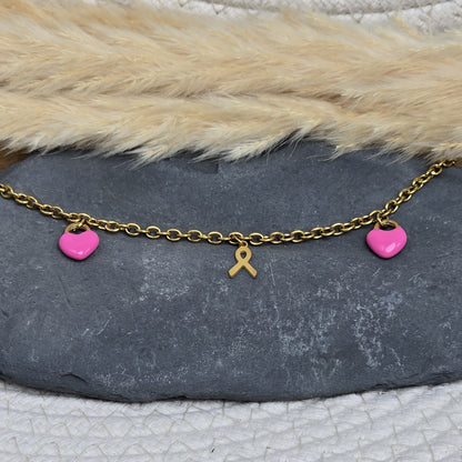 Bijou Octobre Rose avec cœur rose fuchsia et ruban doré sur chaîne en acier inoxydable, fait main par Zateka